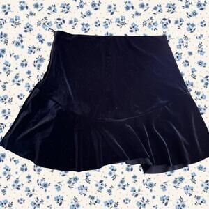 Black velvet mini skirt with ruffle hem
